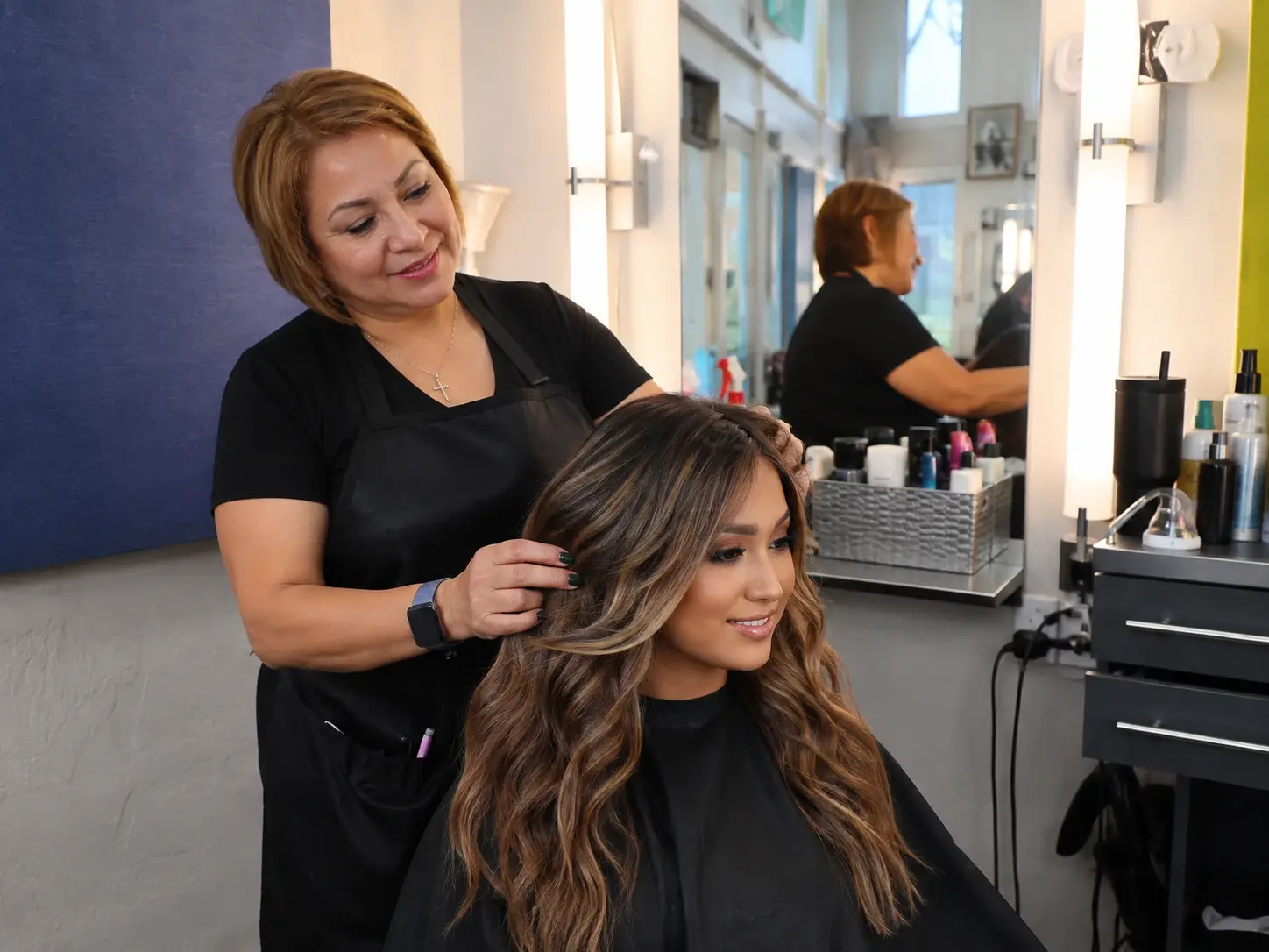 Lilia Marrero working on a client's hair in Mission Hills